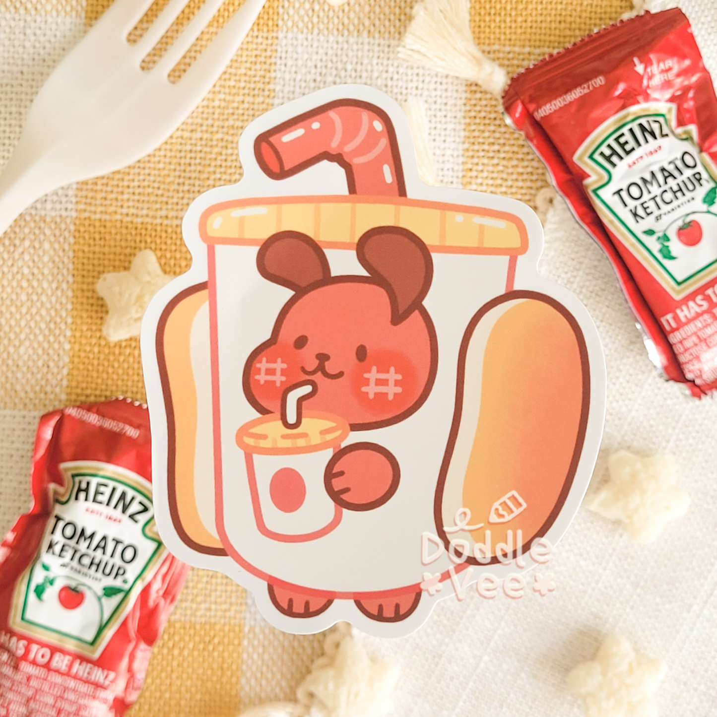 Hotdog or Deli Dog sipping a drink through a straw in a drink costume