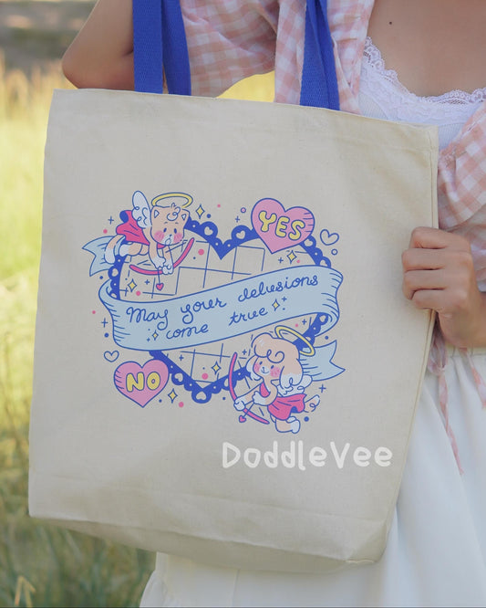 Person holding a tote bag with cartoon design and text, standing outdoors.