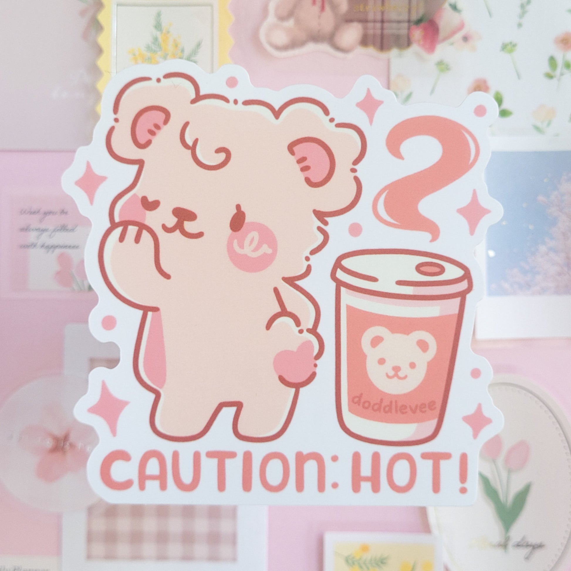Sticker of white bear posing with the words caution: hot appearing at the bottom of the sticker.