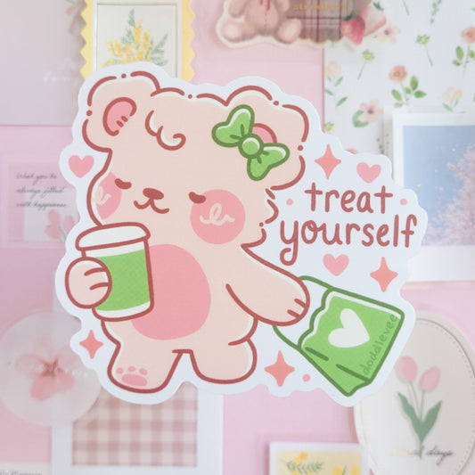 Sticker with white bear holding coffee cup and green shopping bag with the words treat yourself.