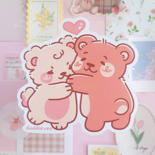 Sticker of pink and white bear hugging.