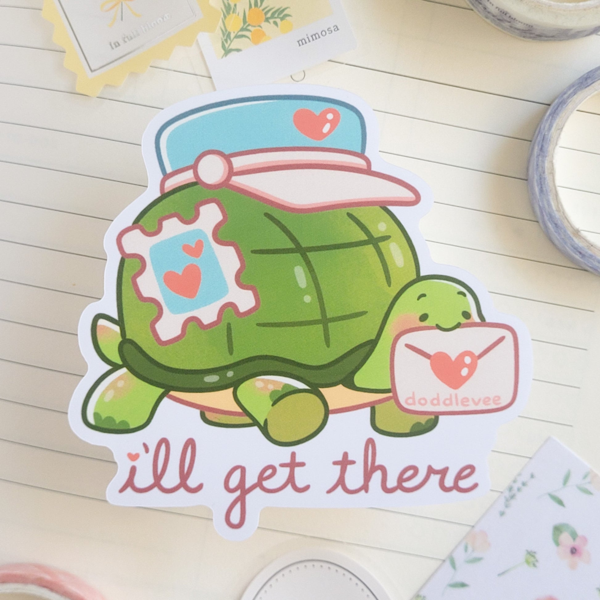 Sticker with a turtle carrying a letter with the text I'll get there.