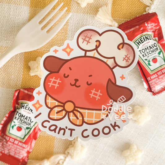 Sticker of a cartoon character with 'I Can't Cook' text on a checkered background with ketchup packets.