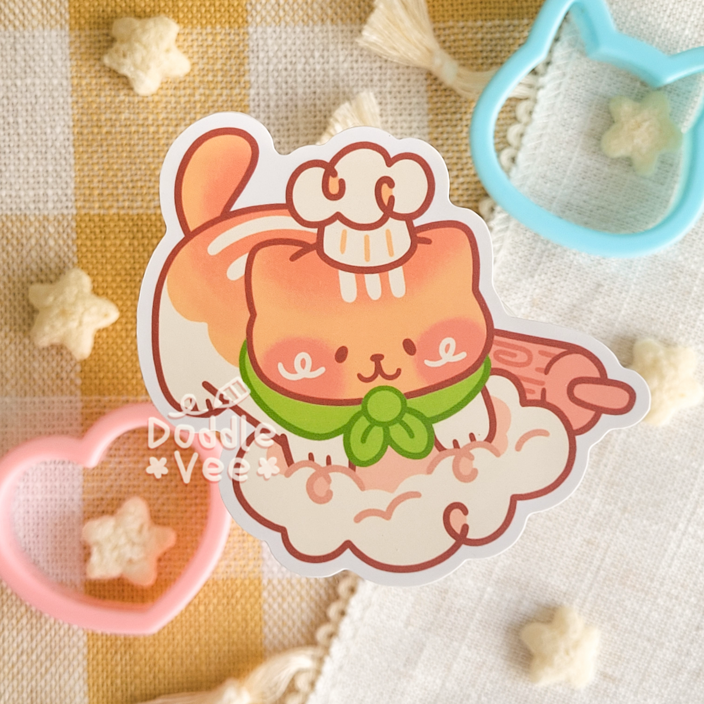 Cartoon cat sticker with a bow on a checkered fabric background