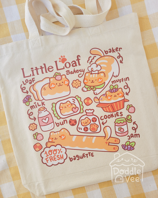 Tote bag with cute bakery-themed design on a checkered tablecloth
