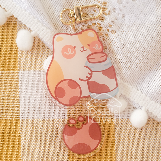Cartoonish bear charm on a checkered fabric background