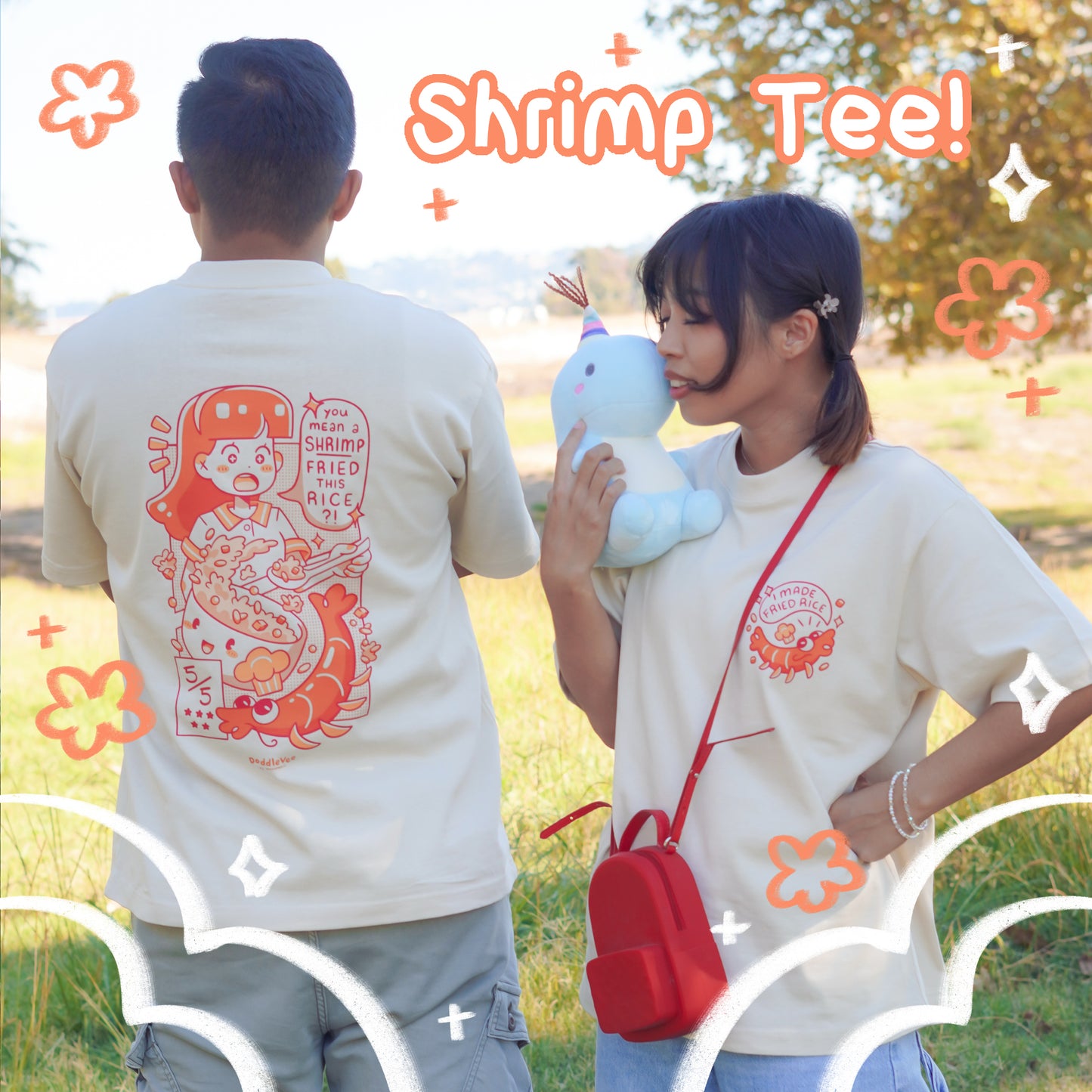 Two people wearing 'Shrimp Tee!' shirts in a park setting.