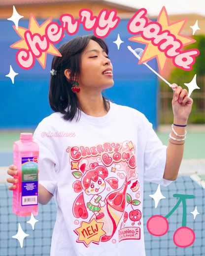 Person wearing a 'Cherry Bomb' themed t-shirt with graphics and text.